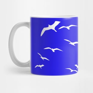 Seagulls traveling in the wind Mug